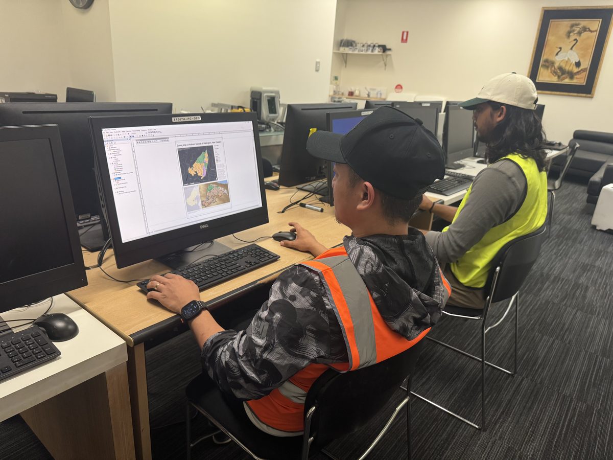 Students working with mapping software on computers in the SRDITA training room