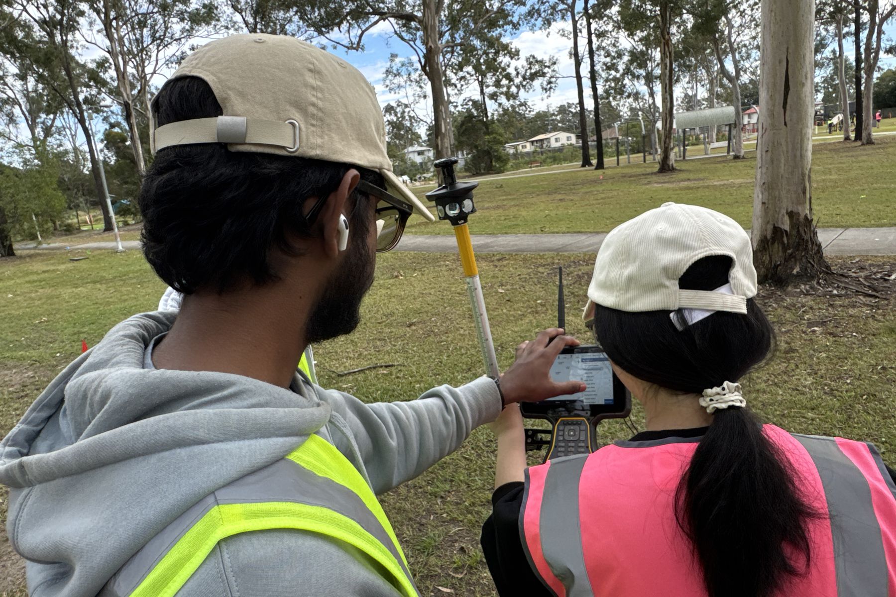 SRDITA students using a GNSS controller during outdoor fieldwork